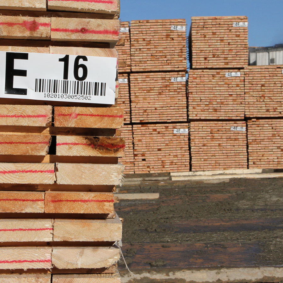 Labelled lumber stacked in yard